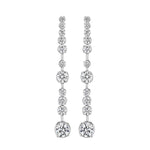 Pair of 18K white gold and diamond earrings on a white background