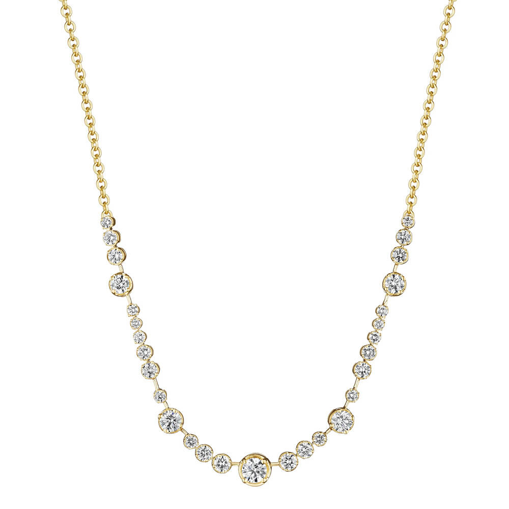 An 18K yellow gold necklace featuring a graduated row of round-cut clear diamonds on a plain white background.