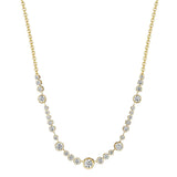 An 18K yellow gold necklace featuring a graduated row of round-cut clear diamonds on a plain white background.
