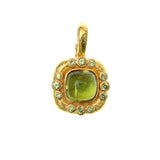 19K Gold pendant with a large Peridot gemstone on a white background