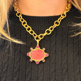 19K Gold chain necklace with a pink Venetian Glass Intaglio pendant on a black sweater