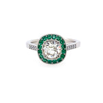 Diamond ring with emerald halo set in platinum
