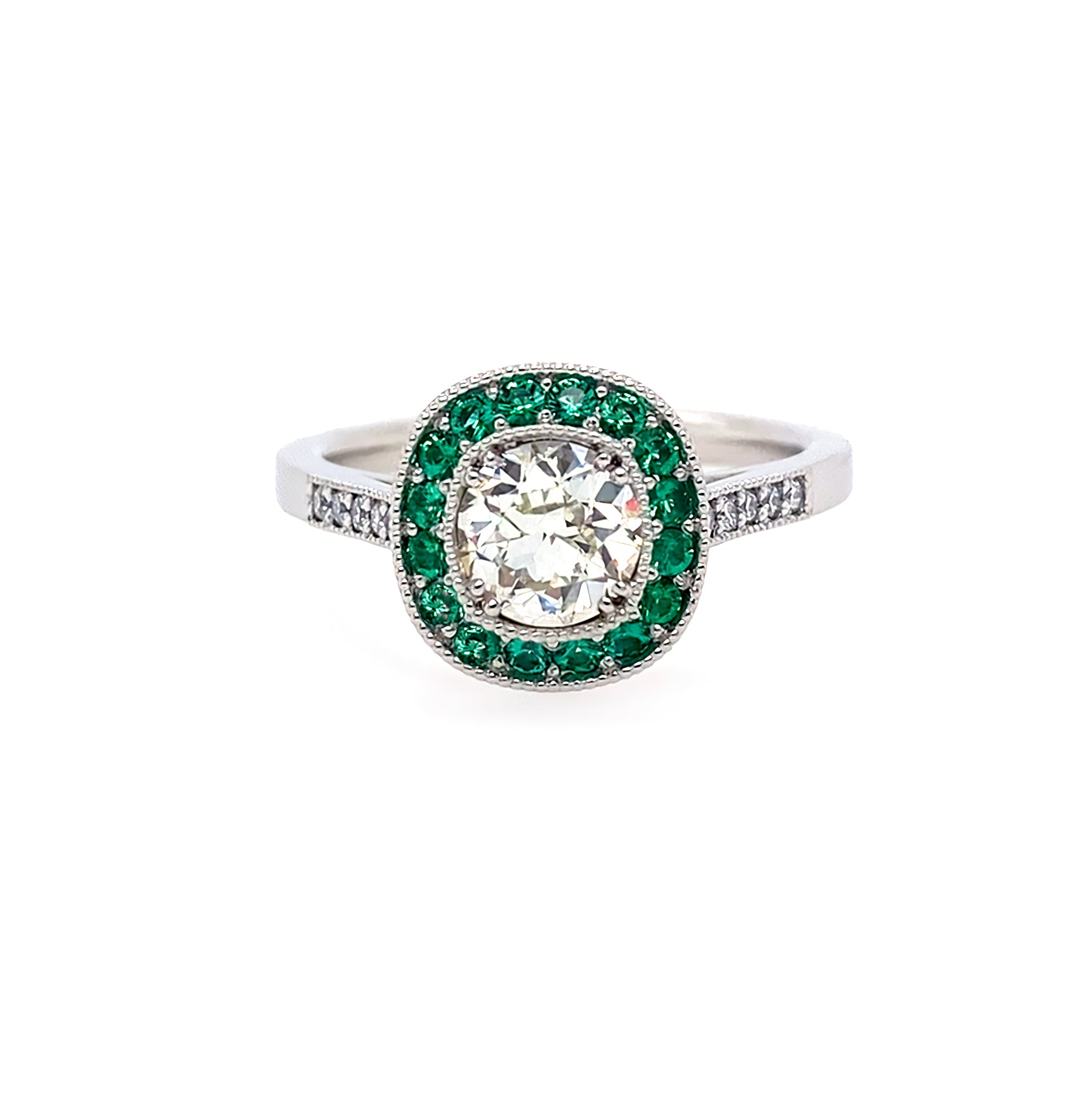 Diamond ring with emerald halo set in platinum