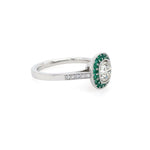 Side View Diamond ring with emerald halo set in platinum