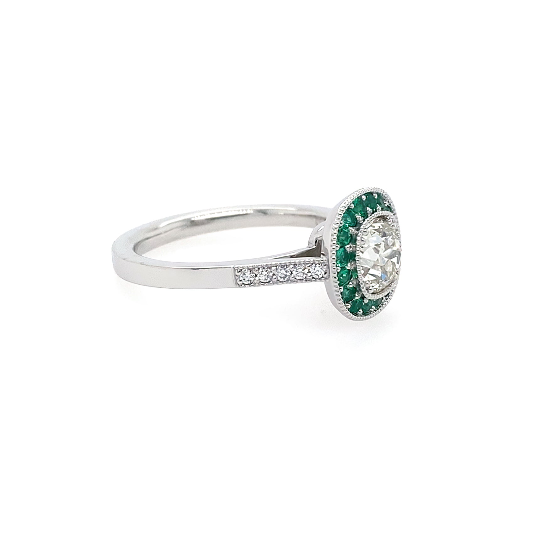 Side View Diamond ring with emerald halo set in platinum