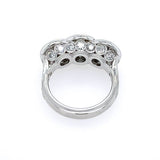 A platimun vintage-style ring featuring three bullseye diamonds