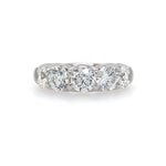A platinum ring with five round-cut diamonds set in a row.