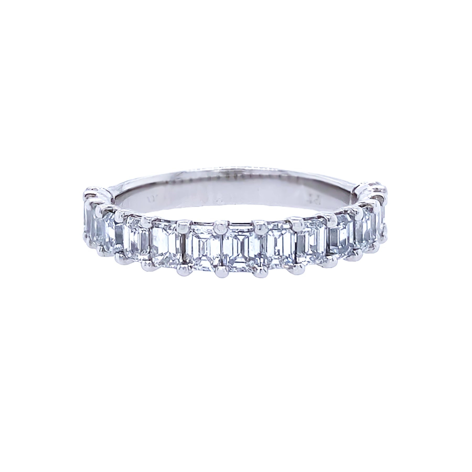 A platinum emerald cut diamond half eternity band with multiple diamonds