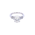 Custom designed Oval Cut Diamond Engagement Ring with Tapered Baguettes in Platinum