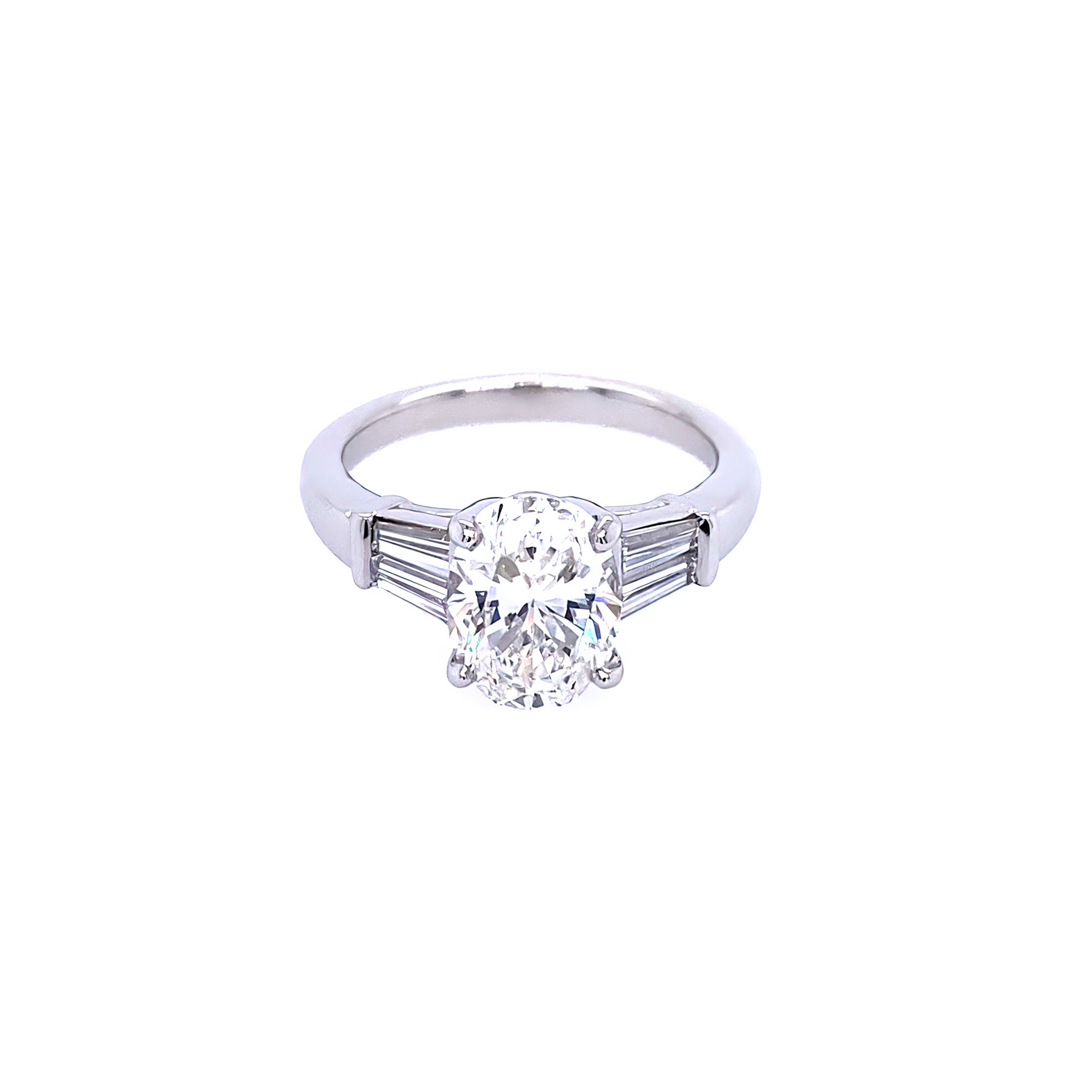 Custom designed Oval Cut Diamond Engagement Ring with Tapered Baguettes in Platinum