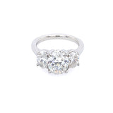 This image features an exquisite Platinum and Diamond Three Oval Diamond Ring. The ring showcases a stunning trio of oval-shaped diamonds, each beautifully set in a platinum band.