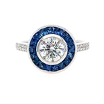 Platinum art deco round diamond ring with sapphire and diamonds  