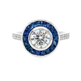 Platinum art deco round diamond ring with sapphire and diamonds  