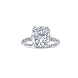 Diamond ring with a large central gemstone and smaller stones on the band against a white background