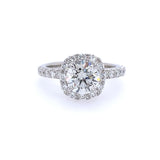 A platinum band ring with a central diamond and smaller diamonds set around it.