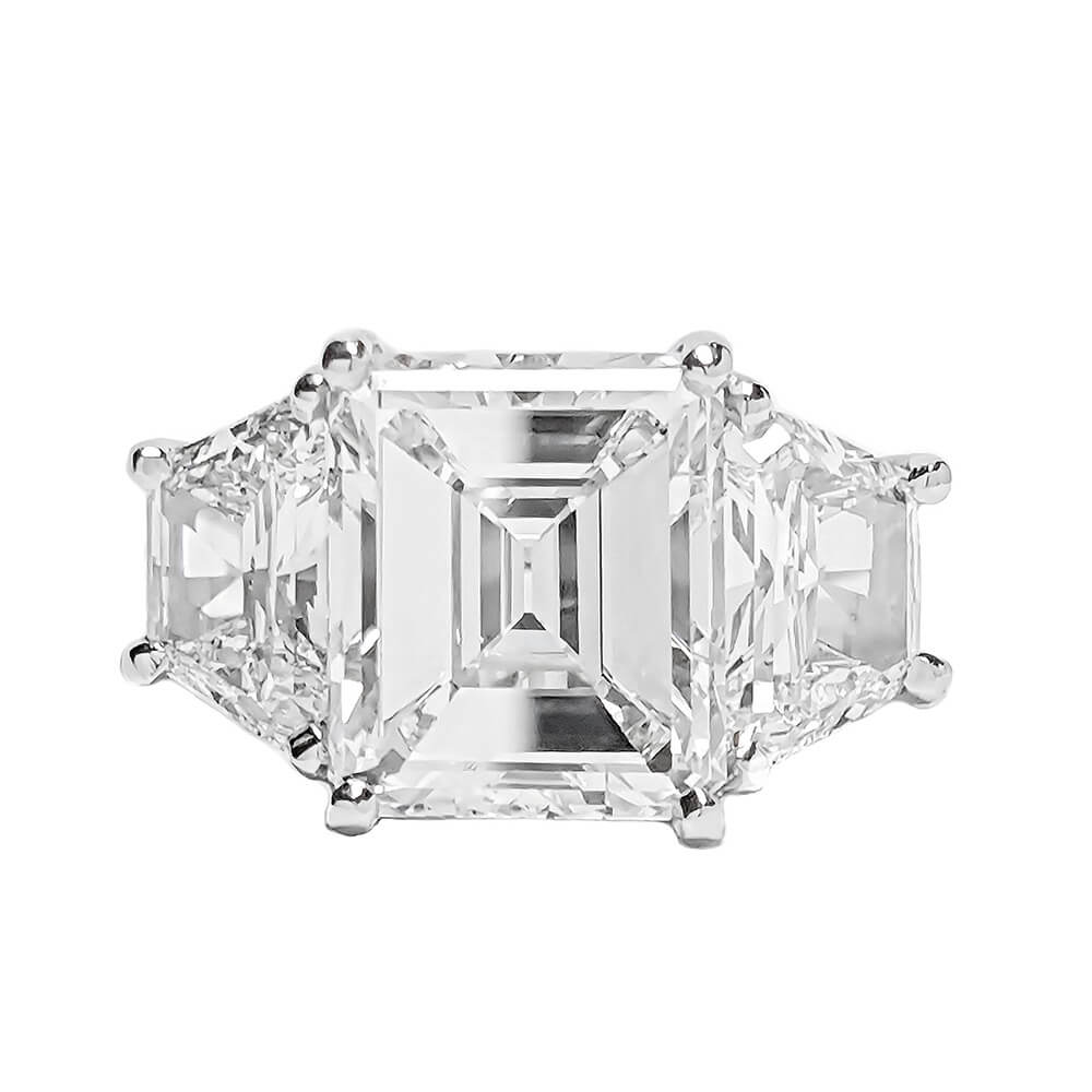 Emerald cut diamond ring on a white background