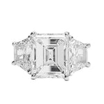 Emerald cut diamond ring on a white background