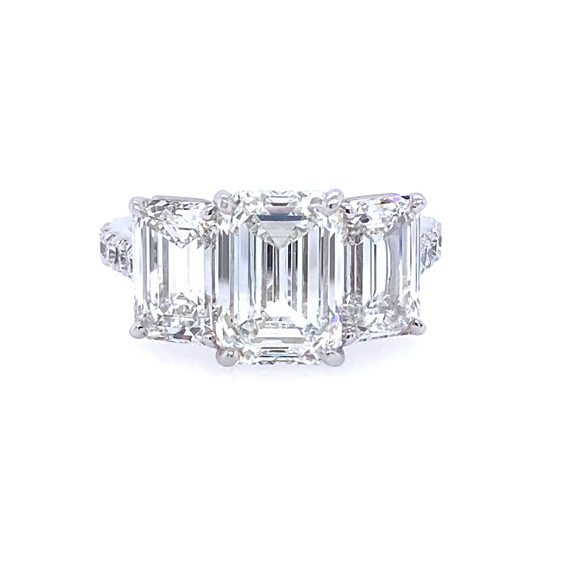 Custom designed 3 stone emerald cut diamond ring set in platinum