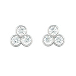 Pair of platinum earrings with three round diamonds on a white background