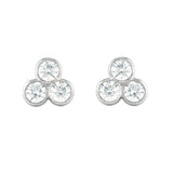 Pair of platinum earrings with three round diamonds on a white background