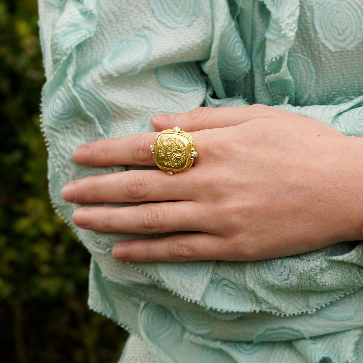 woman wearing Elizabth Locke 19K gold Queen Bee ring with diamonds