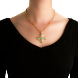 19K Gold necklace with a Maltese Cross pendant featuring turquoise stones on a black background