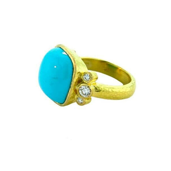 19K Gold ring with a turquoise stone and small diamonds designed by Elizabeth Locke