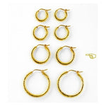 Four Sets of 19K gold hoop earrings on a white background