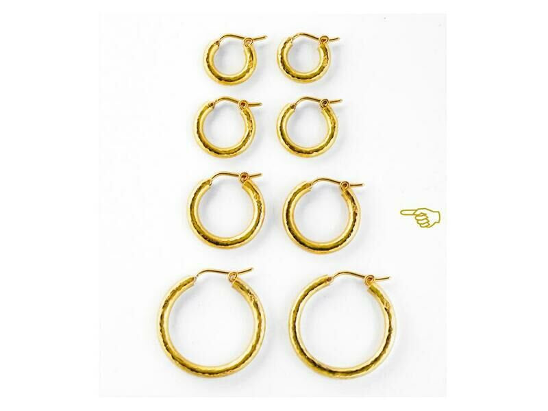 Four Sets of 19K gold hoop earrings on a white background