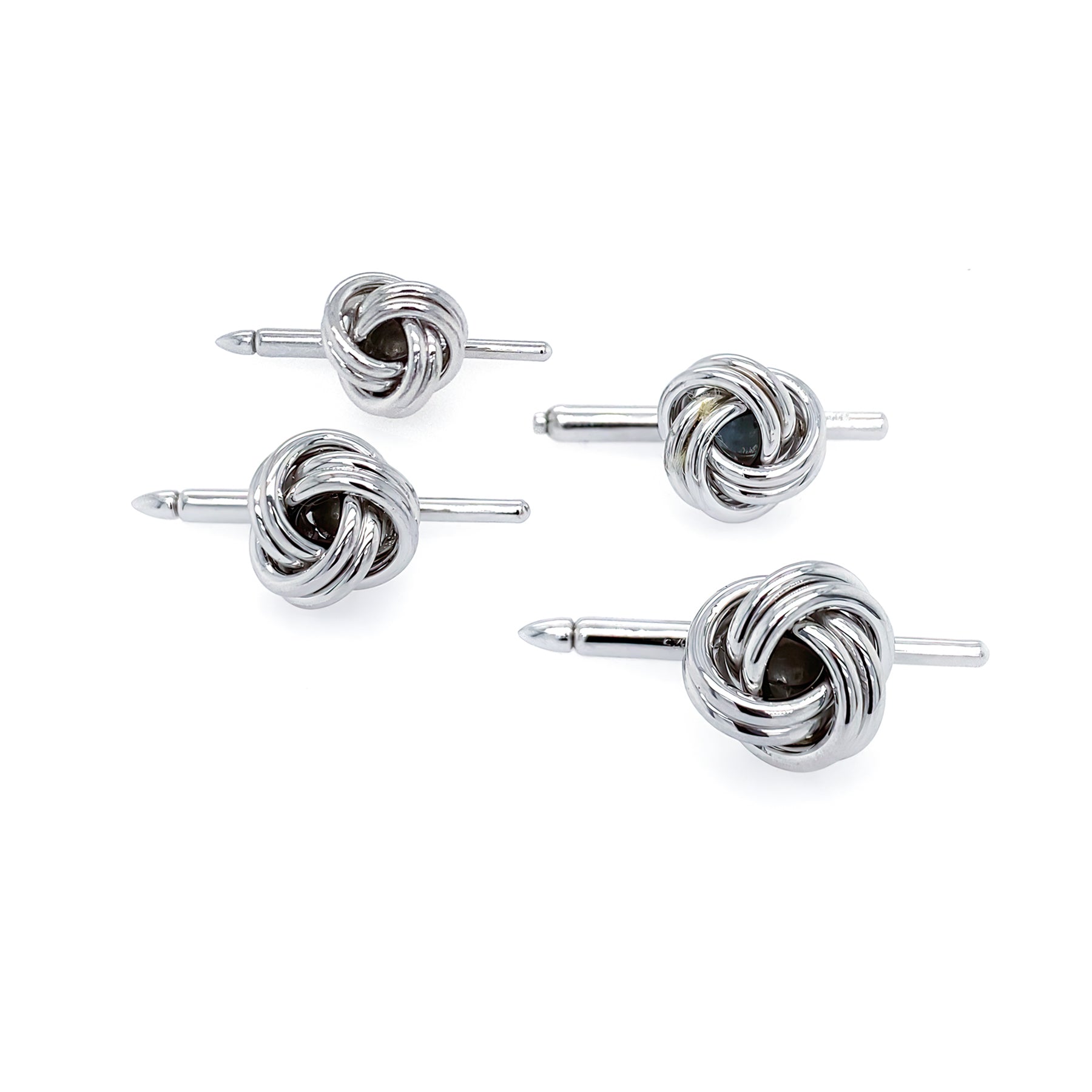 A set of sterling silver knot studs for men.