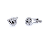 A pair of sterling silver knot cufflinks with a reflective surface.