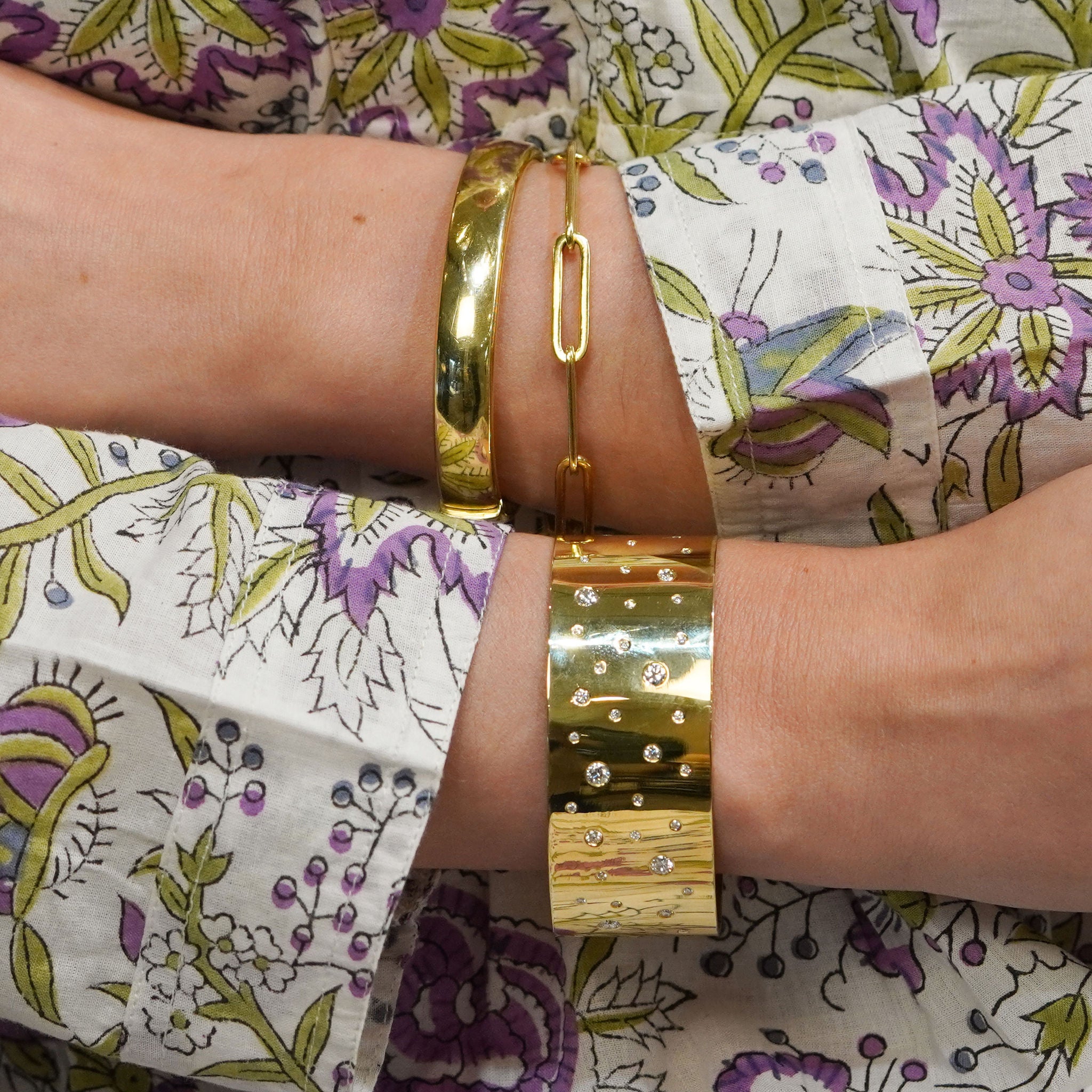Woman wearing Susan cuff bracelet with flush set diamonds