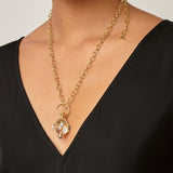 woman wearing Temple St Clair Blue Moonstone Amulet on a long gold link necklance