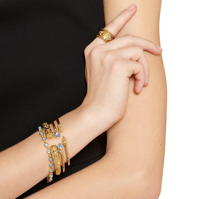 Woman wearing multiple Temple St Clair bracelets