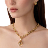 Woman wearing Temple St Clair 18K gold Arcadia Amulet on a gold chain necklace