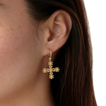 Woman wearing Temple St Clair 18K gold Fiori Cross Earrings