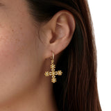 Woman wearing Temple St Clair 18K gold Fiori Cross Earrings