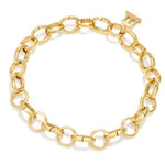 An 18K yellow gold charm bracelet with a link chain design designed by Temple St. Clair