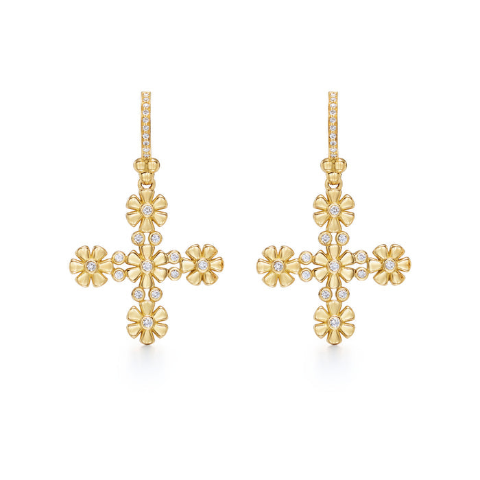 A pair of 18K yellow gold Fiori cross earrings with diamond accents.