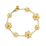 An 18K yellow gold bracelet featuring a series of gold flower charms with diamond accents.