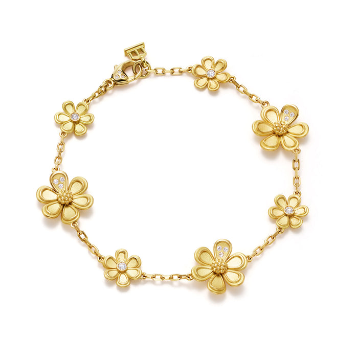 An 18K yellow gold bracelet featuring a series of gold flower charms with diamond accents.