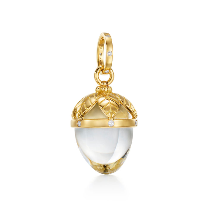 A Temple St. Clair 18K yellow gold medium-sized Arcadia amulet with a clear crystal and gold and diamond details.