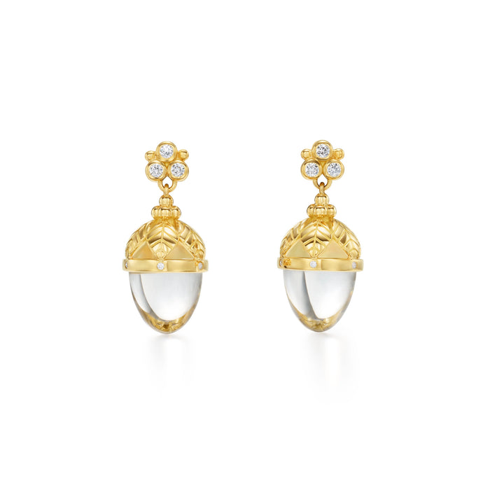 A pair of 18K yellow gold Arcadia amulet earrings with a clear central stone surrounded by yellow gold and adorned with diamonds.