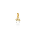 An 18k yellow gold granulated amulet with a natural rock crystal and diamond accent