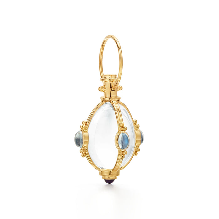 An 18K yellow gold amulet pendant featuring blue moonstones with yellow gold accents and a loop for a chain attachment.