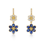 A pair of 18K yellow gold drop earrings featuring diamond accents and blue sapphire flowers designed by Temple St Clair