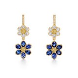 A pair of 18K yellow gold drop earrings featuring diamond accents and blue sapphire flowers designed by Temple St Clair