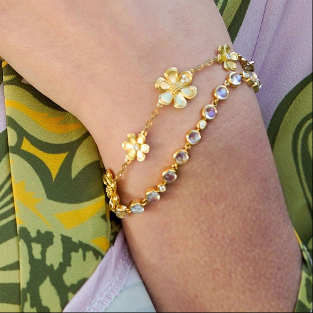 Woman wearing Temple St Clair Flower Bracelet with Diamonds