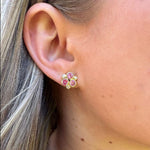 Woman wearing Temple Pink Sapphire stud earrings