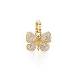 An 18K yellow gold pendant in the shape of a butterfly, adorned with diamonds.